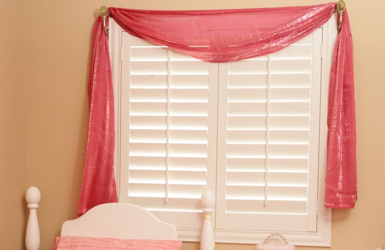 Child's room with white shutters.